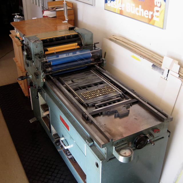 FAG Control 405, inked with blue, composing with brass lines, ready for printing.